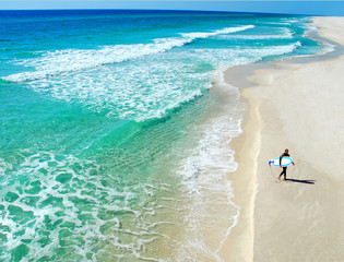 Lone Surfer on Beautiful Deserted Beach - 4610421