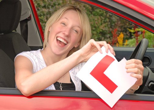 Happy Woman Just Passed Driving Test With Ripped L Plate