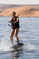 Fototapeta na wymiar Girl Wakeboarding at Lake Powell