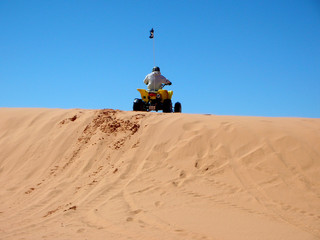 a rider on desert wehicle