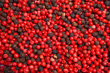 Close-up of dried black and red peppercorns
