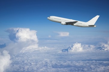 Naklejka na ściany i meble Airliner wspinaczka ponad chmurami