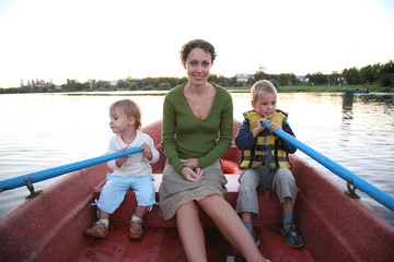 Fototapeta na wymiar mother with children go for a boat