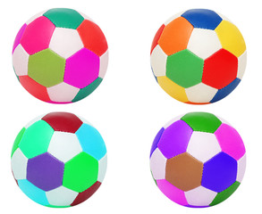 Footballs of four different colors isolated on white