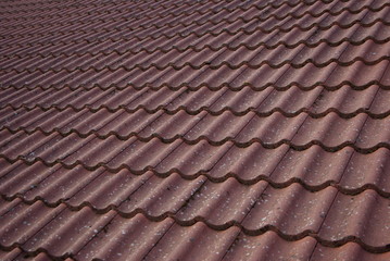 Red color texture of roof tiles background view