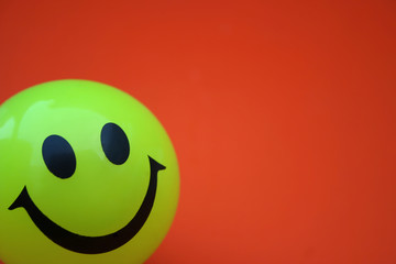 yellow smile in red background