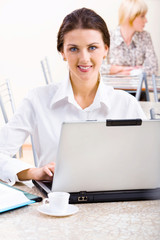 Woman in a cafe. Wonderful color selection