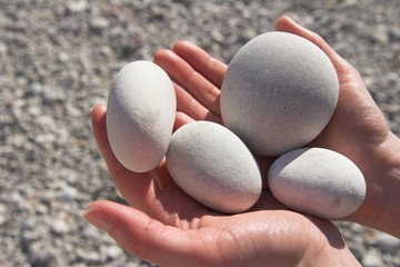 holding smooth rocks