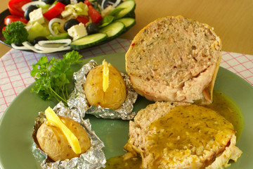 Stuffed chicken rolls with baked potatoes  and greek salad