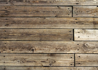 Old hevaily used wooden floor on pier