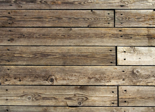 Fototapeta Old hevaily used wooden floor on pier
