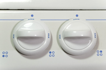 two stove buttons