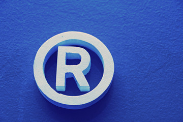 R Registered trademark in a blue background