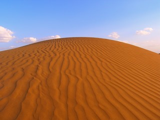 The dune waves in Indian desert with blue sky