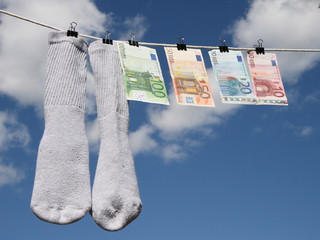 money laundering, euros drying up on the rope with socks