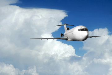 Airliner coming out of clouds - obrazy, fototapety, plakaty