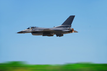 Modern American jet fighter with motion blur