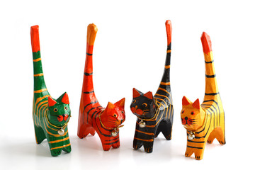 Four wooden cats