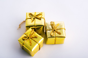 christam gift boxes wrap in golden paper