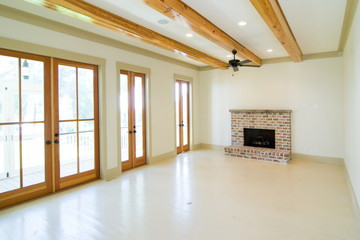 white unfurnished livingroom with wood beams