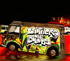 Colourful graffiti image of a bus