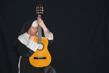 Nun playing the guitar
