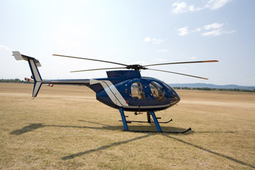 blue helicopter on the ground