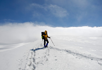 Fototapeta na wymiar Lonely climber on top of mountain