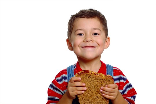 Boy With Peanut Butter Sandwich On Whole Wheat Bread