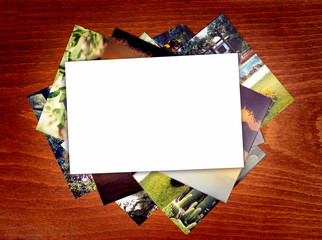 blank photo paper on wooden background