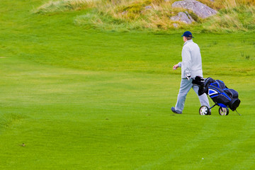 Golfer walking
