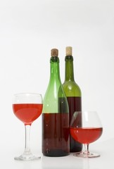 Red wine bottles and glasses isolated 