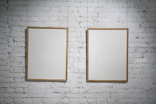 two blank frames on the white wall