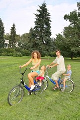 Fototapeta premium family on bicycles