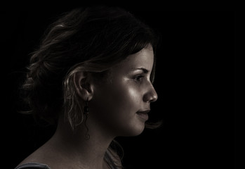 Dreamy portrait - Woman profile on dark background