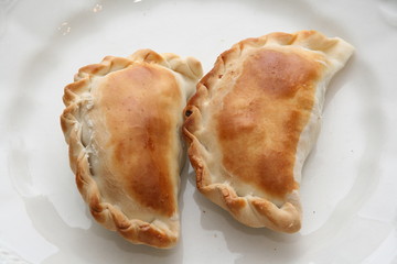Empanadas argentinas. Comida típica regional de Argentina. Empanadas caseras de carne. Alimento....