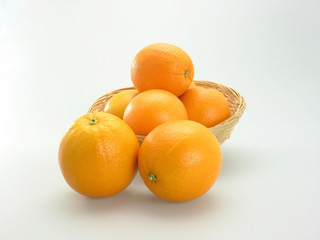orange in bamboo basket