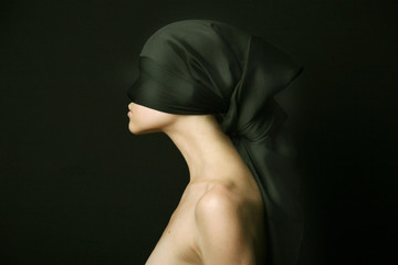 Nude woman with black bandage
