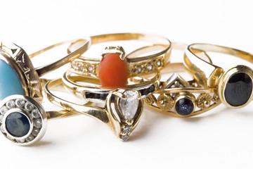 Golden rings with precious stones