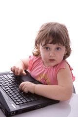 Child looks at laptop