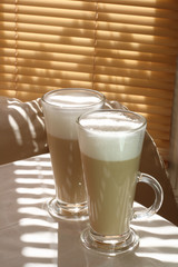 Cafe Latte in a tall glass with another one