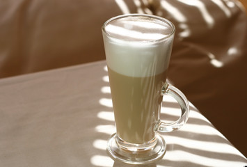 Cafe Latte in a tall glass and sunny light