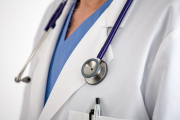 Doctors stethoscope with scrubs and lab coat