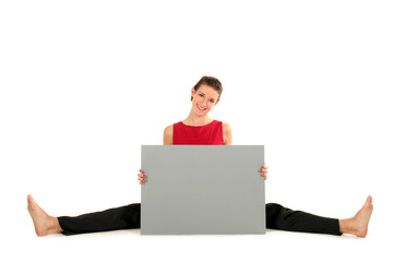 Woman with blank card doing a split