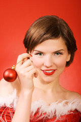 christmas girl holding a toy