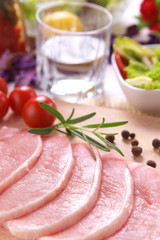 Fresh meat with tomato and rosemary