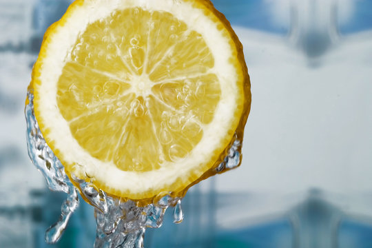 refreshing lemon slice and water drops