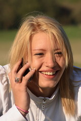 Young woman laughing on a mobile phone