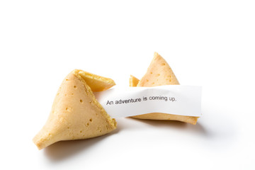 isolated broken fortune cookie w/ message