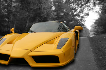 Yellow Super Car on a black and white road background